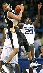 Memphis' Anthony Rice (23) and Southern Miss' Charles Gaines battle for a rebound during the second half.