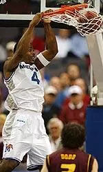 Chris Massie dunks the ball over Arizona State's Kyle Dodd during the first half of this NCAA West Regional first round game.