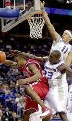Anthony Rice and Duane Erwin play tenacious defense against Houston's Andre Owens.