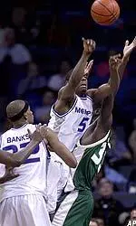 Jeremy Hunt snatches a rebound between two players during the second half.