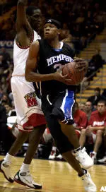 Sean Banks drives to the basket past Maryland's Ekene Ibekwe during the first half of the Basketball Hall of Fame Tip Off Classic.