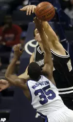 Darius Washington attemps a layup while defended by Providence's Randall Hanke.
