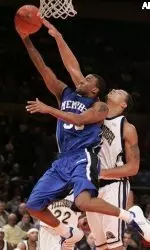Darius Washington Jr., left, is fouled by Pittsburgh's Chevron Troutman while attempting a shot during the first half.