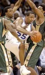 Center Arthur Barclay shimmies around three UAB defenders.