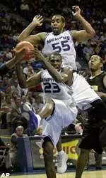 Anthony Rice and Arthur Barclay battle for a rebound during the second half.