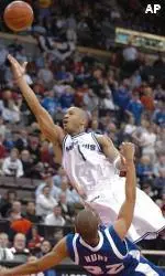 Antonio Burks drives past Saint Louis defender Phillip Hunt in the first half.