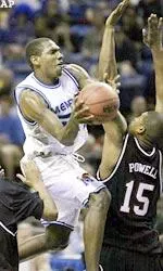 Anthony Rice drives against South Carolina's Tarence Kinsey and Carlos Powell.