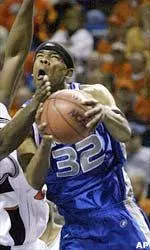 Sean Banks draws contact from Oklahoma State forward Ivan McFarlin on his way to the basket. Banks finished with 11 points.