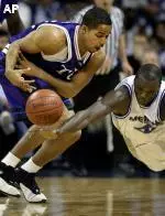 Modibo Diarra knocks the ball away from TCU's Blake Adams during the first half.