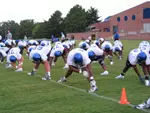 The Tiger Football team stretches prior to practice.