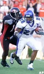 Darron White breaks away from Arkansas State defenders in the first quarter.