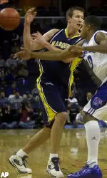 Rodney Carney makes a steal from Marquette's Steve Novak during the first half. Carney led Memphis to victory over Marquette 78-68 with 29 points.
