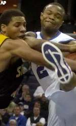 Tank Beavers fights through the defense of Southern Mississippi's Dwayne Brown in the first half.