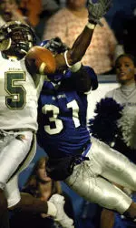 Memphis defender Jamaal Rufus, right, knocks away the ball from UAB's Jhun Cook (5) in the end zone during the first half at Liberty Bowl Memorial Stadium in Memphis, Tenn. Tuesday, Nov. 1, 2005. (AP Photo/The Commercial Appeal, Mark Weber )