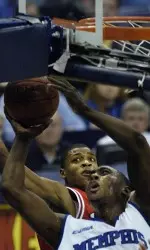 Joey Dorsey grabs a rebound over Lamar's Alan Daniels. (AP Photo/ Mark Weber)