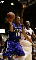 Memphis forward Rodney Carney reaches around Ole Miss guard Brandon Patterson for a first half layup. (AP Photo/Rogelio Solis)