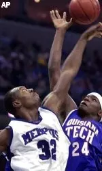 Joey Dorsey blocks a shot by Louisiana Tech's Paul Millsap during the second half.