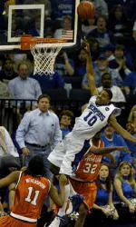 Rodney Carney shoots over Virginia Tech players Wynton Witherspoon and Carlos Dixon, right, during the first half of an NIT game.