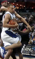 Cincinnati's James White and Roy Bright double-team Duane Erwin during the first half.
