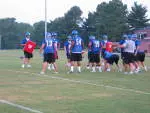 The offensive line works together in the first practice of the 2005 season.