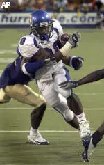 Memphis tailback DeAngelo Williams scores a touchdown as Tulsa's Burnell Smith misses the tackle in the first half. Williams scored three touchdowns and rushed for 223 yards. (AP Photo/David Crenshaw)