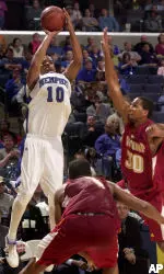 Memphis' Rodney Carney, top, fires a three-pointer over Winthrop's Billy Houston, right, and James Shuler. (AP Photo/Lance Murphey)