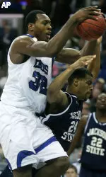 Joey Dorsey (32) pulls a rebound away from Jackson State's Julius Young (24) during the first half. (AP Photo/Lance Murphey)