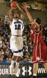 Antonio Anderson pulls up for a shot over Oklahoma's Michael Neal in the first half.