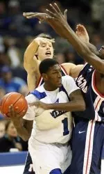 Mississippi guards Todd Abernethy, left, and Clarence Sanders put Memphis' Willie Kemp in a trap in the first half.