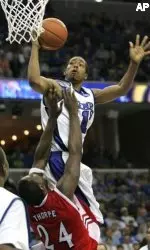 Antonio Anderson drives for the basket over Houston's Jahmar Thorpe during the first half.