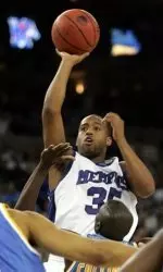 Darius Washington, Jr., shoots over UCLA during the second half. (AP Photo/Paul Sakuma)