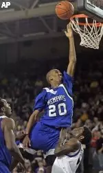 Memphis' Doneal Mack (20) scores two of his 15 points over the defense of Brandon Evans, right, during the second half.  (AP Photo/Karl B. DeBlaker)