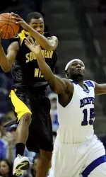 Southern Miss guard Jeremy Wise and Andre Allen fight for the ball during the first half.