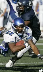 Memphis wide receiver Duke Calhoun flies through the air with help from Rice defender Andrew Sendejo in the second half. (AP Photo/Pat Sullivan)