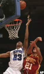 Derrick Rose goes to the basket against USC's Dwight Lewis during the second half.