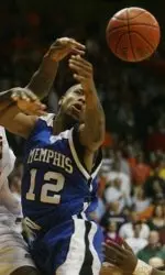 Antonio Anderson fights for a loose ball during the first half.