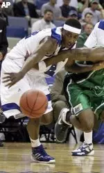Memphis' Robert Dozier, left, and North Texas' Harold Stewart, front right, go for the ball in front of Memphis' Chris Douglas-Roberts.  (AP Photo/Alex Brandon)