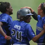 Brittany Gooch is congratulated by teammates Leandra Hines and Kimmi Hayden after tying the game on a wild pitch in the seventh.