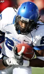 Memphis running back Curtis Steele (26) carries the ball against SMU's line backer Will Bonilla (27) in the first half. (AP Photo/Tom Pennington)