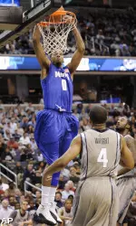 Shawn Taggart dunks over Georgetown's Chris Wright (4). (AP)