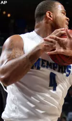 Memphis forward Pierre Niles-Henderson (4) grabs the ball as Northeastern forward Manny Adako reaches in during the first half. (AP Photo/Nikki Boertman)