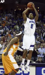 Memphis guard Anotnio Anderson (5) shoots over Tennessee forward Wayne Chism during the first half (AP Photo)