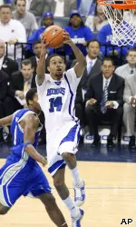 Memphis guard Chris Douglas-Roberts flies to the basket ahead of Tulsa forward Calvin Walls. (AP Photo/Bill Waugh)