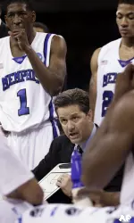 John Calipari talks with his team during a time out during the 85-67 victory over Texas. (AP Photo/David J. Phillip)
