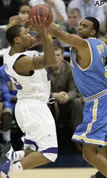 Derrick Rose goes up for a shot in front of UCLA's Josh Shipp in the semifinals. (AP Photo)
