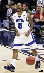 Antonio Anderson celebrates after making a basket during the first half against UCLA. (AP Photo)