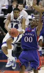 Chris Douglas-Roberts - who averaged 23.3 points per game in the NCAA tournament - goes to the basket in front of Kansas' Darrell Arthur. (AP Photo)