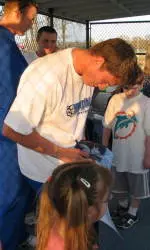 Sophomore Trey Wiedman signs a poster at Southaven's Field of Dreams