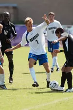 Senior Sean Goulding dribbles past the Mercer defense