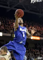 Antonio Anderson is fouled by UCF guard A.J. Rompza while shooting during the first half. (AP Photo/Reinhold Matay)